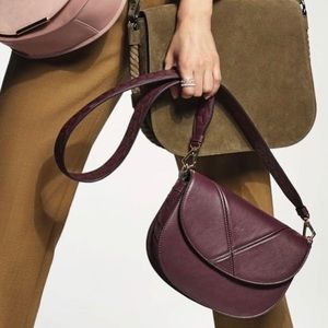 Welden woven crossbody bag in oxblood color